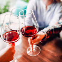 Cedar City Wine Tasting | My Local Utah A group of friends clinking glasses with red wine at park city wine festival my local utah