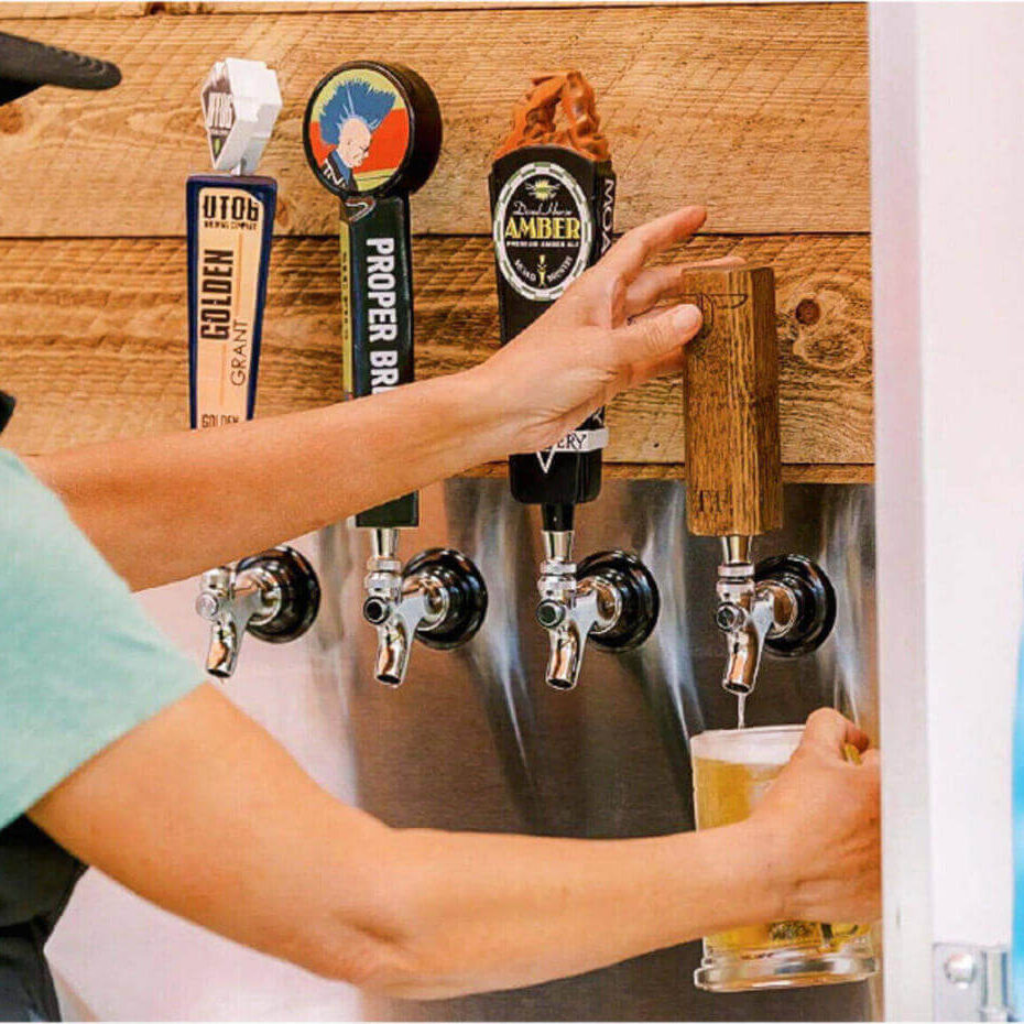 deer valley mountain beer festival bartender serving beer from tap.