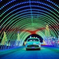 Christmas in Color 1 | My Local Utah A stunning tunnel adorned with vibrant colorful lights at the christmas in color event The illuminating tunnel creates an immersive experience inviting everyone to enjoy the festive ambiance together My local utah