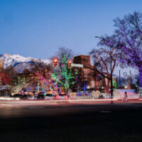 The santas workshop display in ogdens christmas village shines with festive decorations and twinkling lights bringing santas world to life Children gather around excited to see where the magic of christmas begins my local utah