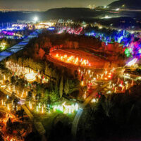 A breathtaking illuminated pathway lined with vibrant glowing christmas decorations at thanksgiving points luminaria lights Twinkling lights and softly glowing lanterns guide visitors through a winter wonderland filled with festive colors and holiday cheer My local utah