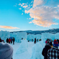 Family Fun at the Ice Castles in Midway | My Local Utah A breathtaking view of the midway ice castles featuring stunning ice formations illuminated in vibrant shades of blue purple and pink These are another great winter season and festive holiday date activities The intricate ice structures create a magical atmosphere inviting visitors to explore this winter wonderland My local utah
