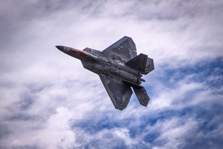 F-22 Raptor slicing through the air in a air show F-22 Raptor slicing through the air in a air show