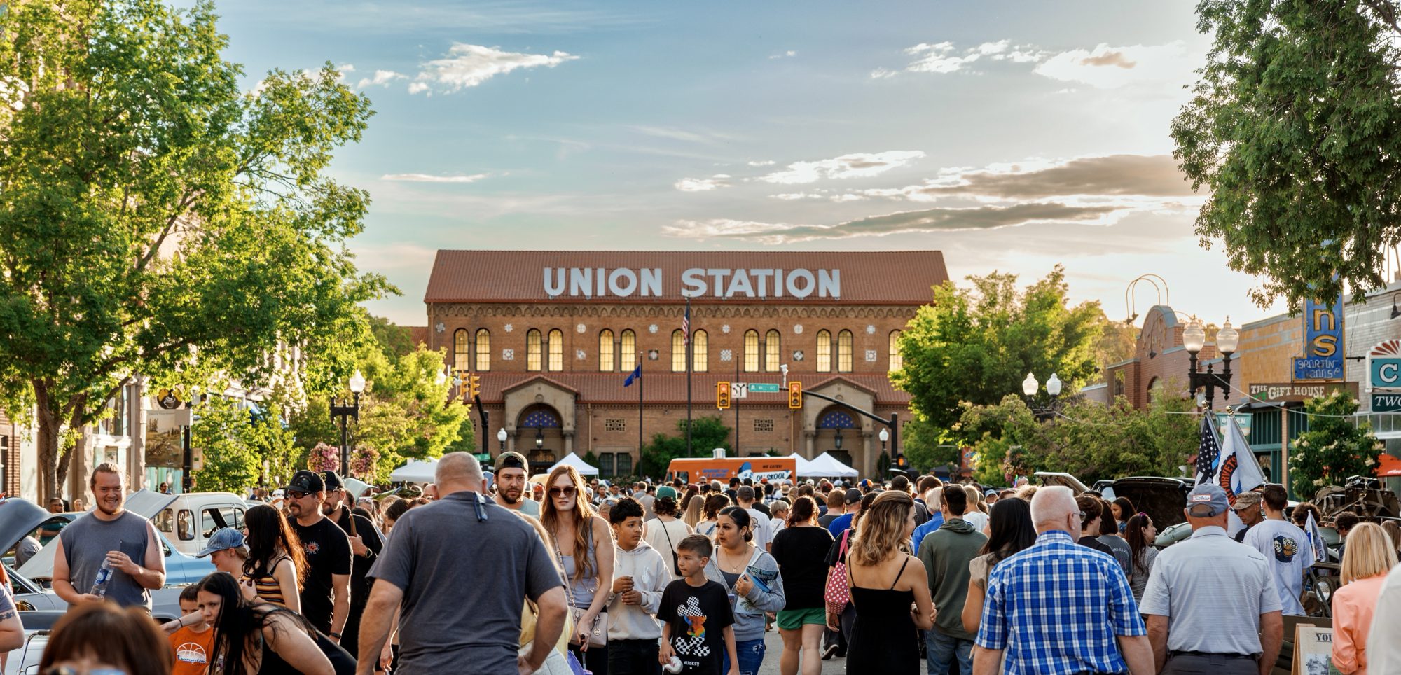 Crowd at the harvest moon festival on historic 25th street in ogden utah with union station in the background my local utah