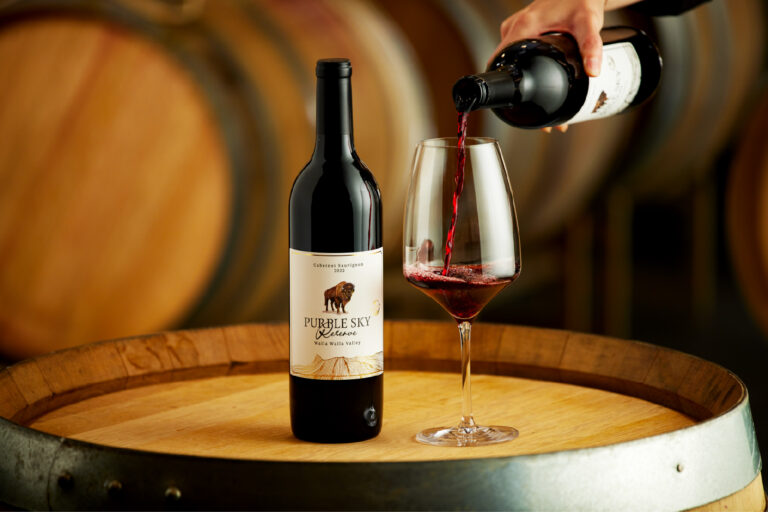 Purple sky winery red wine being poured into class.