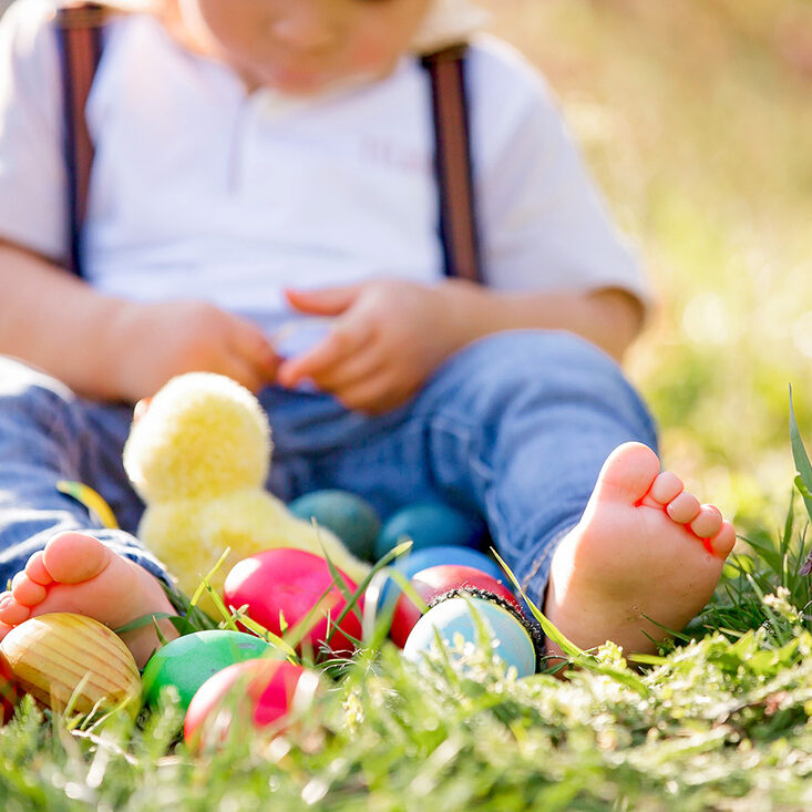 Easter egg hunt events in Utah with kids gathering eggs in a park during springtime in Utah