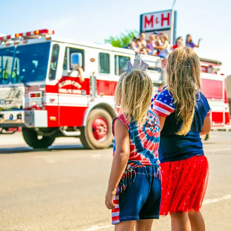 Families attending a summer festival in Utah with food, music, and activities