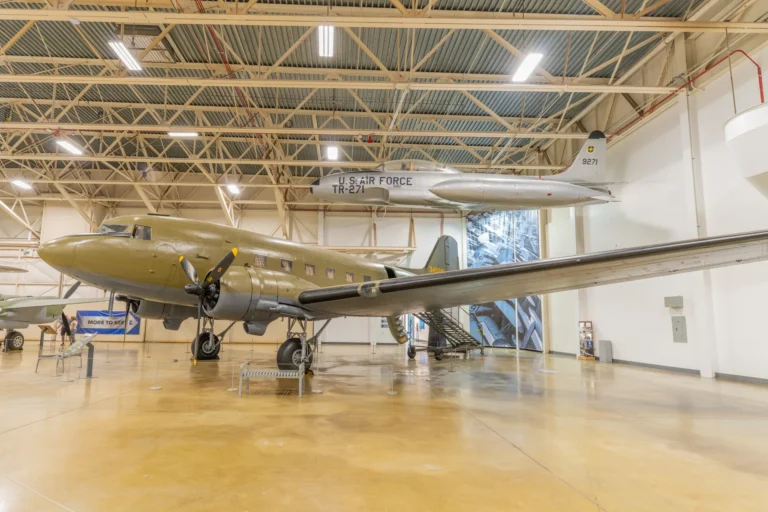Inside the Hill Aerospace Museum gallery Inside a Hill Aerospace Museum gallery in Roy, Utah, with a C-47 Skytrain on the floor and a T-33 trainer suspended overhead
